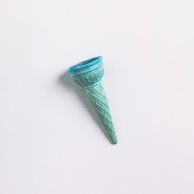 Elevated view of empty ice cream cone on white background