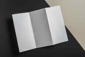 Free photo elevated view of folded white paper for brochure