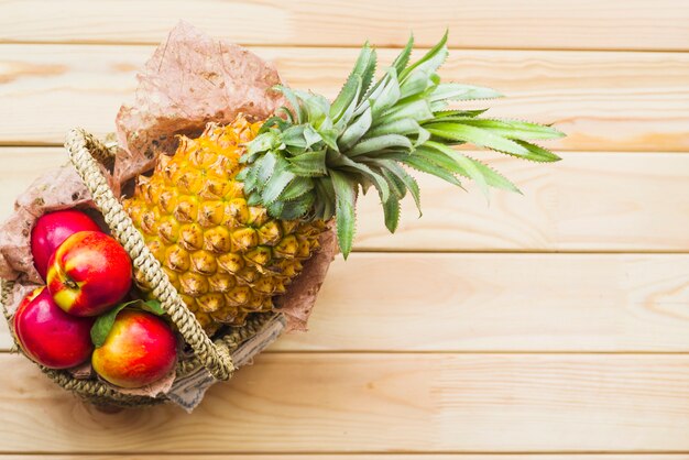 Elevated view of fresh fruits on wooden background
