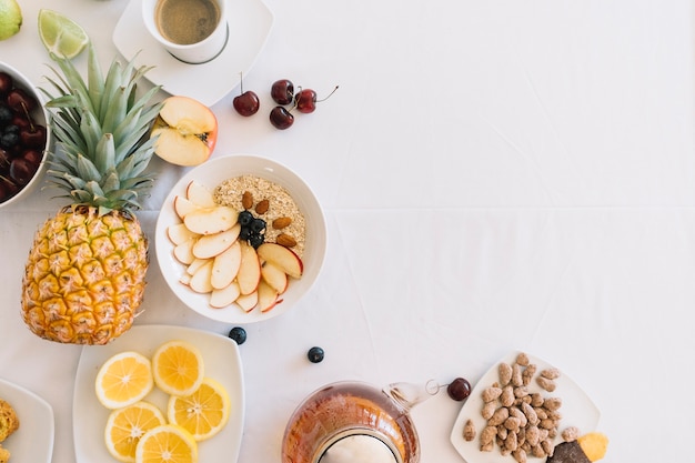 Elevated view of fresh healthy breakfast on white background