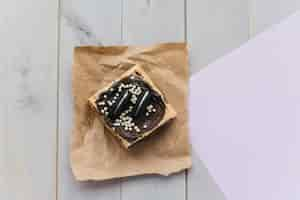 Free photo elevated view of fresh pastry on brown paper