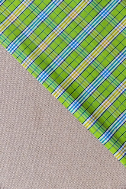 Elevated view of green chequered pattern on plain textile