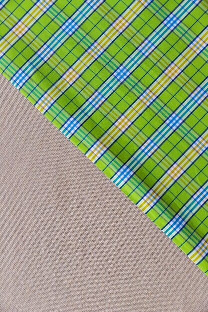 Elevated view of green chequered pattern on plain textile