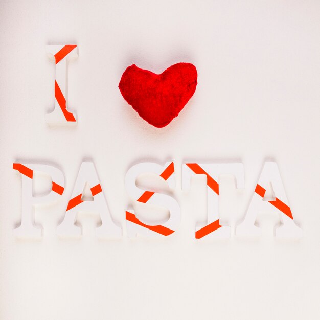 Free photo elevated view of i love pasta on smooth backdrop