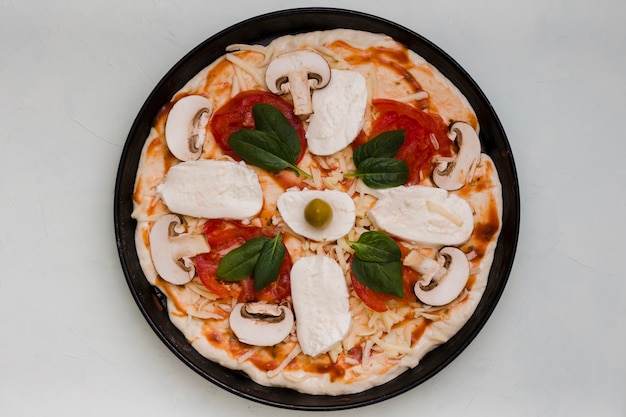 An elevated view of italian pizza on gray concrete background