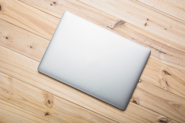 Elevated view of a laptop on wooden plank