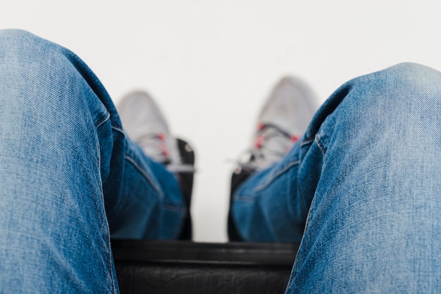 Free photo an elevated view of man's foot on the wheelchair