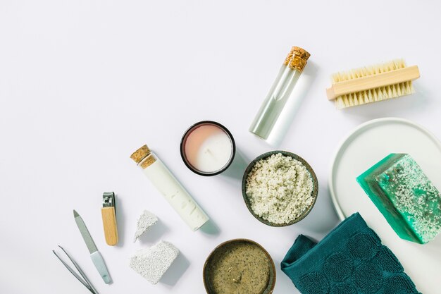 Elevated view of manicure tools and products on white background