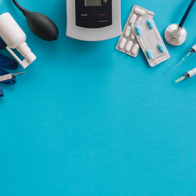 Elevated view of medical equipments on blue background