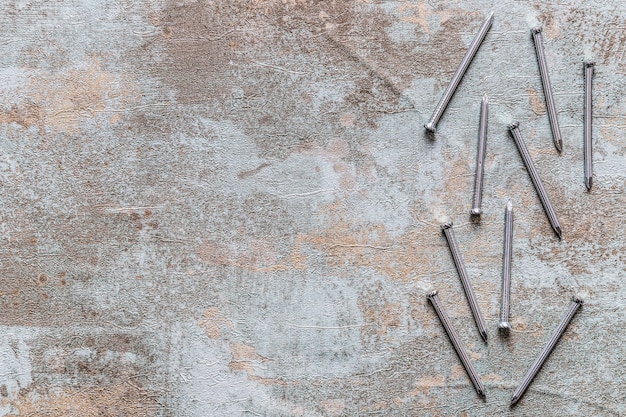 Elevated view of nails on old wooden desk