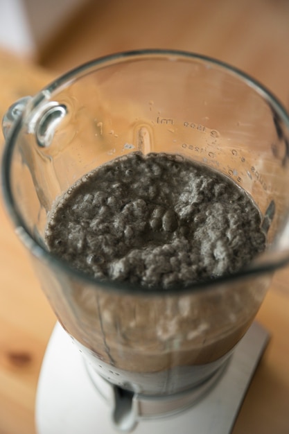 Free photo elevated view of a paper pulp into blender