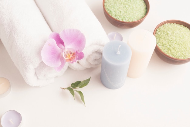 Elevated view of spa setting with bath salt and towel