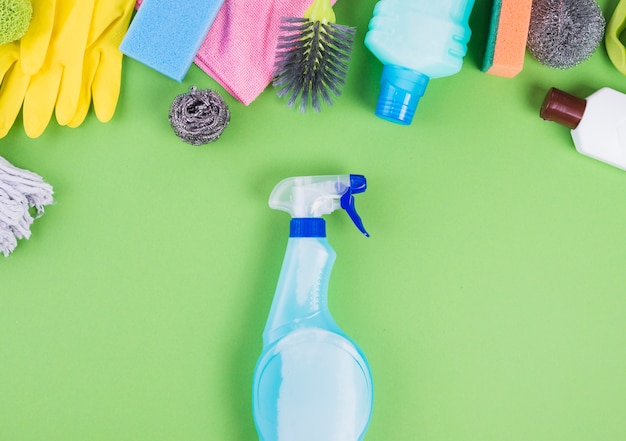 Free photo elevated view of spray bottle near different cleaning items