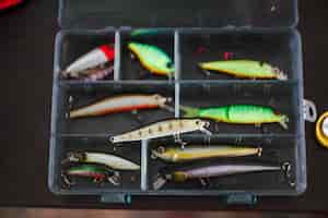 Free photo elevated view of various fishing lures in box