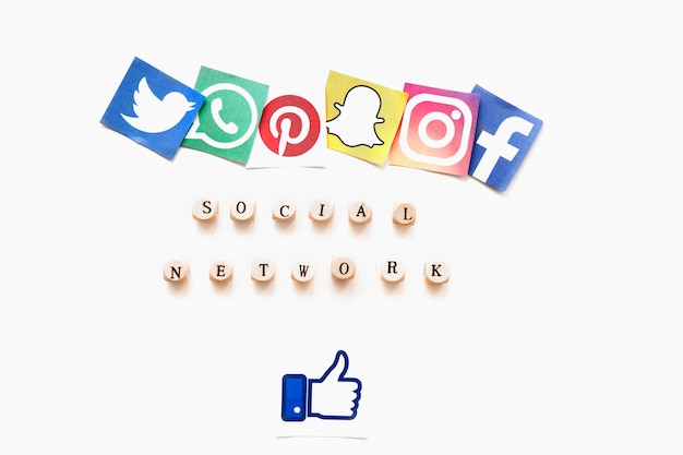 Elevated view of various mobile application icons, social network word and thumbs up sign
