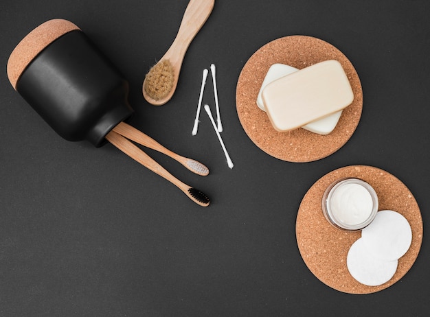 Elevated view of various spa products on black background