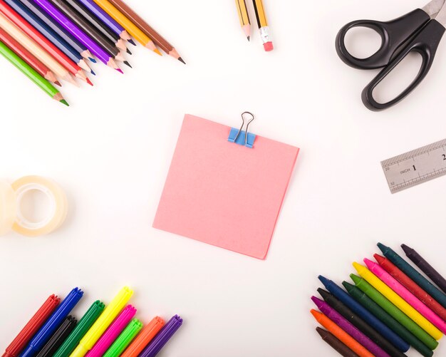 Elevated view of various stationeries on white background