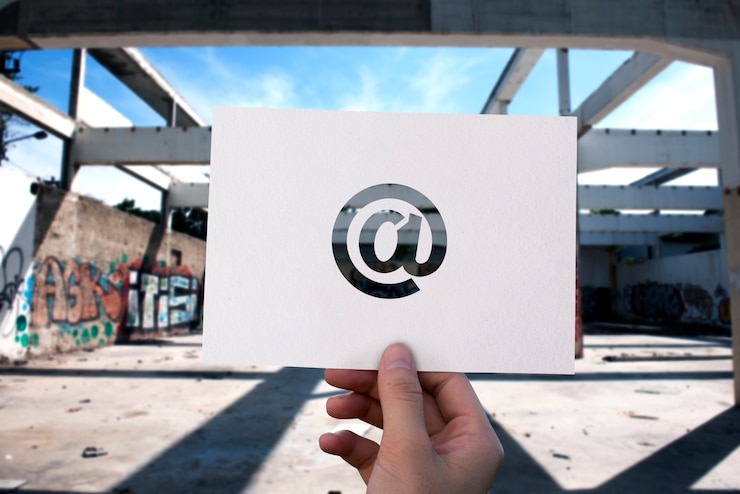 Free Photo email network communication perforated paper at sign
