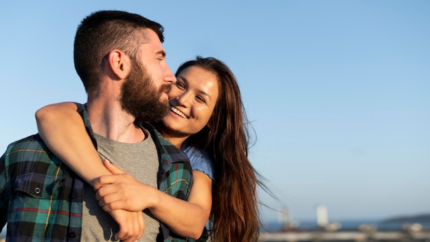 Embraced couple outdoors