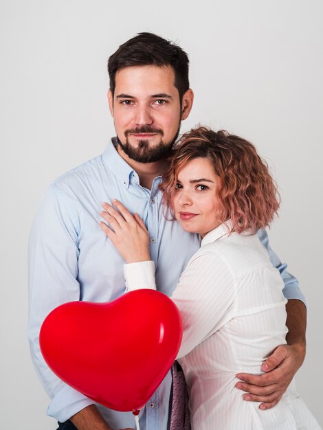 Embraced couple posing for valentines