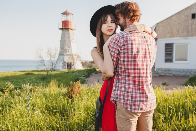 Embracing young stylish couple in love in countryside