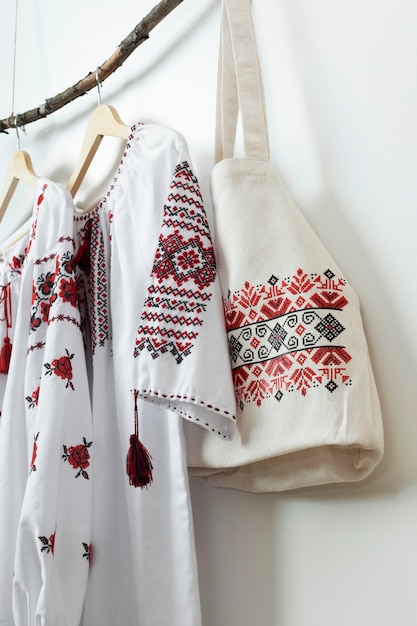 Embroidered shirts and bag hanging