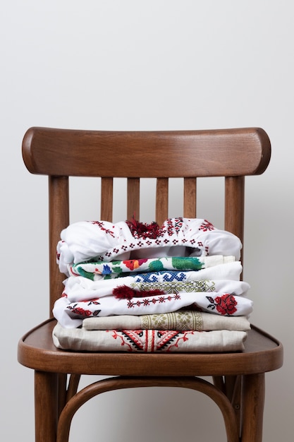 Embroidered shirts on chair arrangement