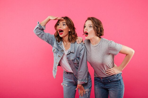 Emotional ladies friends standing isolated