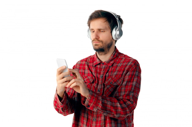 Emotional man using smartphone isolated on white studio