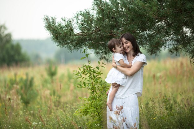 Emotional mother with daughter in arms motherhood