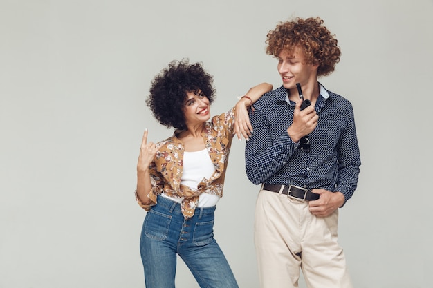 Emotional retro loving couple standing and posing