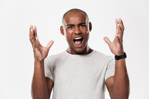 Free photo emotional screaming young african man