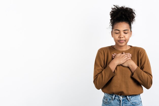 Emotional woman posing with eyes closed