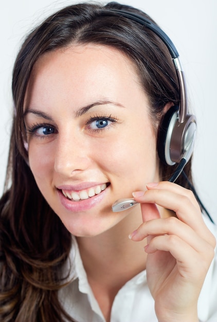 Employee of a call-center smiling at camera
