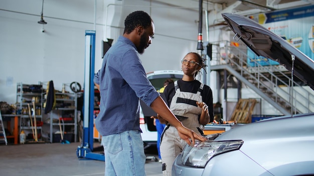 Free photo employee listens to client car request