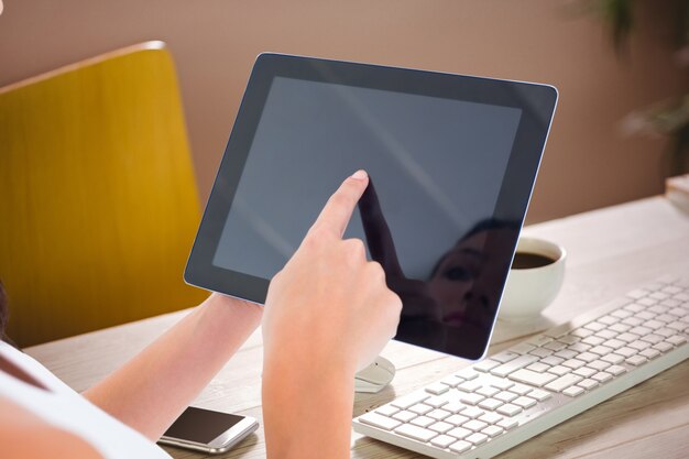 Employee using the tablet in the office