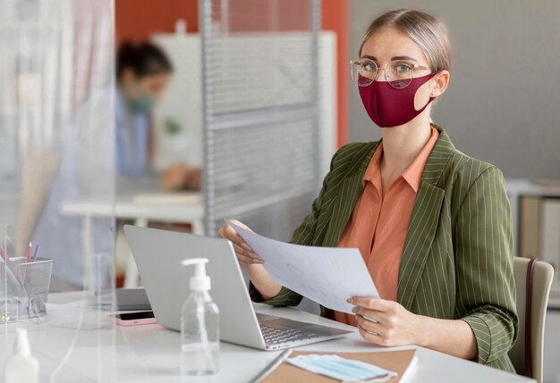 Employee wearing face mask at work
