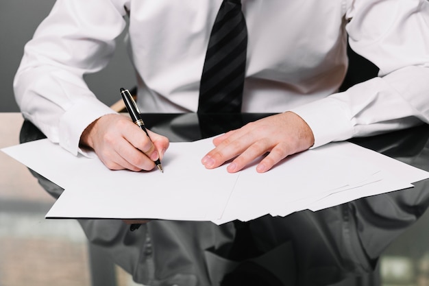 Employee writing in office