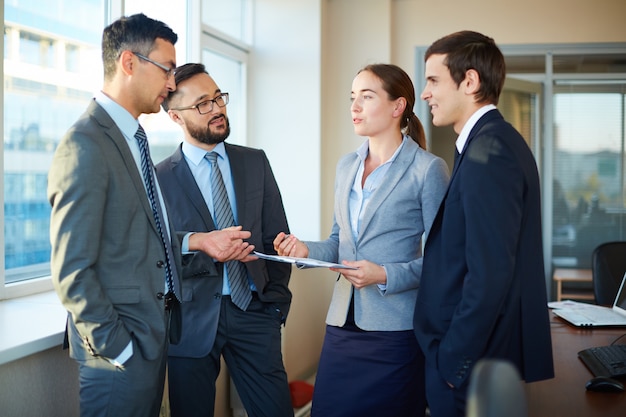 Employees reviewing the clipboard