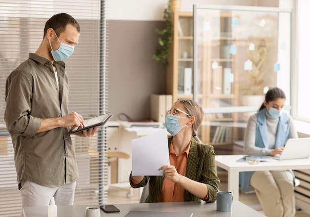 Employees wearing face masks at the office