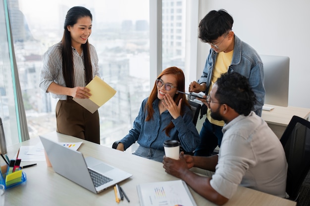 Employees working together high angle