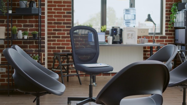 Empty aa meeting space with chairs in circle prepared for group therapy. Nobody in office decorated with furniture for rehabilitation program session with therapist, treating alcoholism.