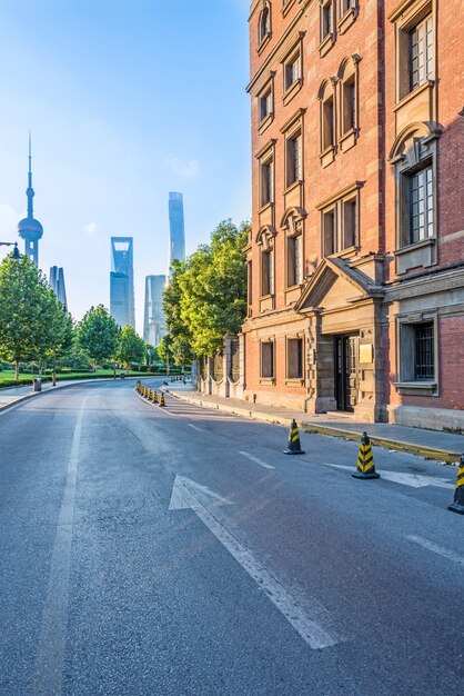empty asphalt road with cityscape and skyline