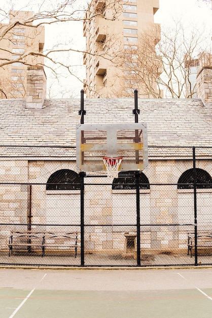 Empty basketball court in city