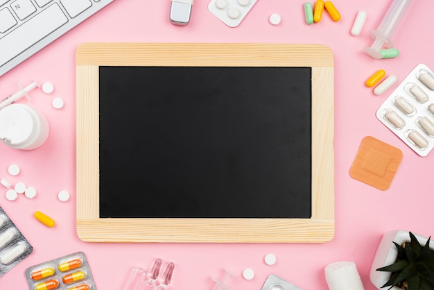 Empty black board next to medical desk arrangement