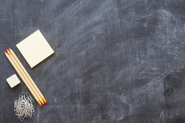 Empty blackboard with stationery