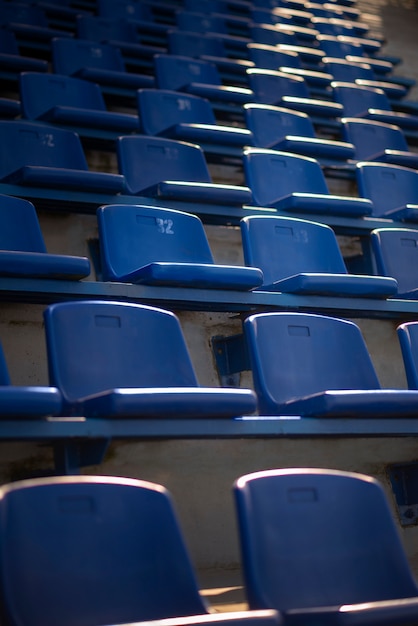 Empty blue grandstands low angle