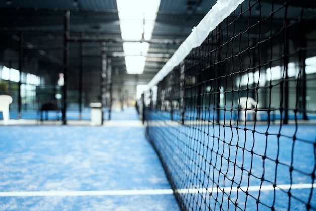 Empty blurry paddle tennis field