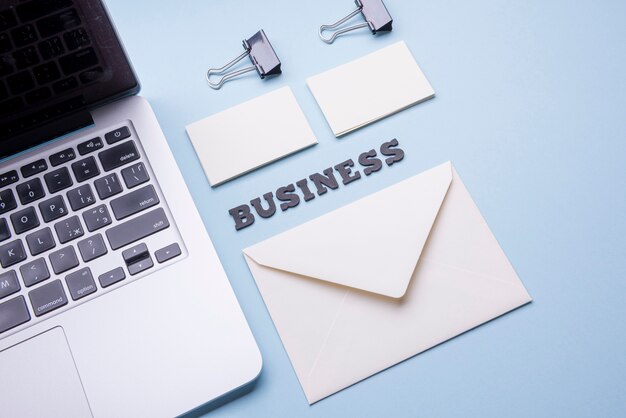 Empty business card and laptop