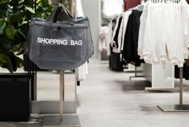 Free photo empty clothing store with shopping bags